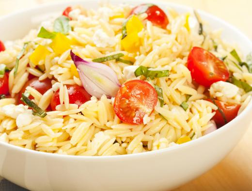 Orzo salad including grape tomatoes, yellow peppers and onions.