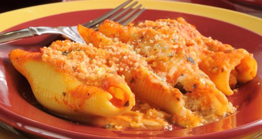 Large conchiglie pasta can be stuffed with a cheese filling and baked in sauce.