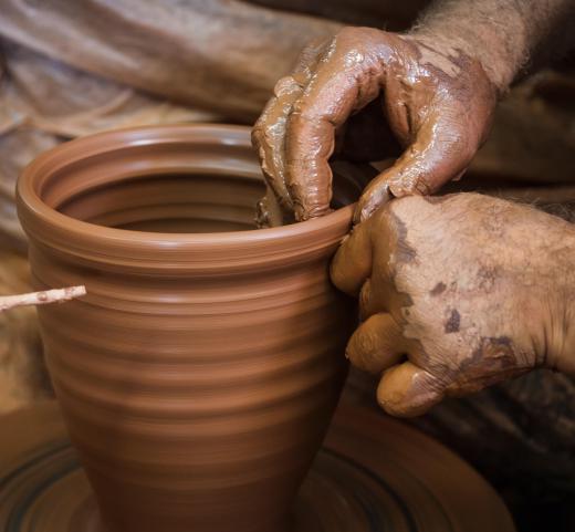 A pottery wheel may be employed to give stoneware a distinct shape.