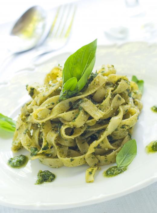 Pesto pasta made with carrot greens.