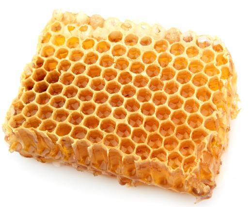 Piece of a honeycomb with buckwheat honey.