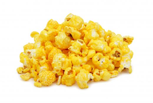 Popcorn is made by popping corn kernels and topping them with butter and savory spices, such as salt.