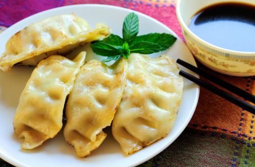 Potstickers can be served steamed with a dipping sauce on the side.