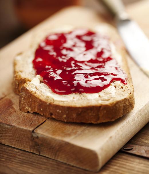 Raspberry preserves may be spread on bread.