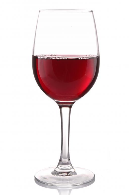 A glass of red wine from a screw-cap bottle.