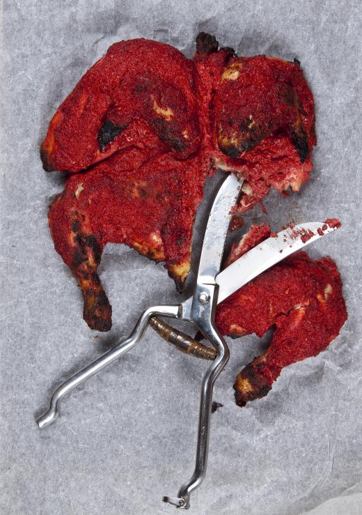 Some kitchen scissors are specially designed to cut through meats, like chickens.