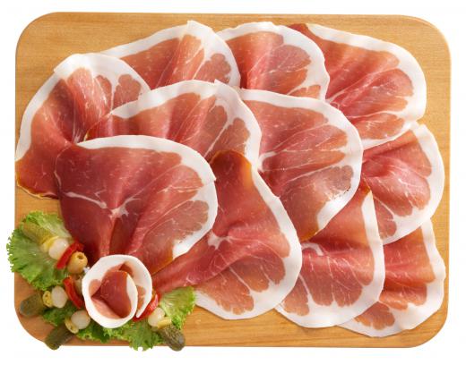 Sliced prosciutto can be included in a shrimp platter.