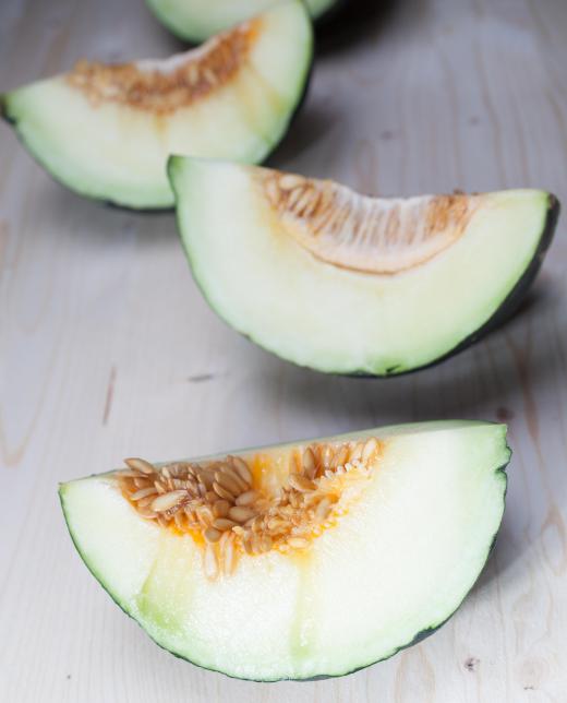 The seeds and pulp should be scooped out of the slices of a Christmas melon before eating.