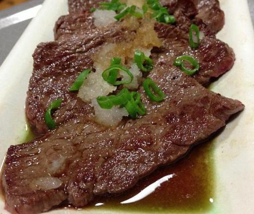 Steak prepared with ponzu sauce.