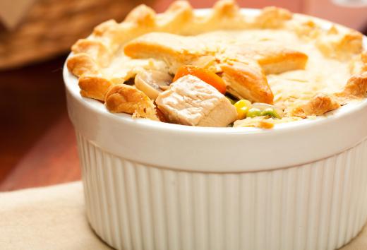 Steak pie is cooked inside of a pastry shell, and consists of steak, vegetables, and gravy.