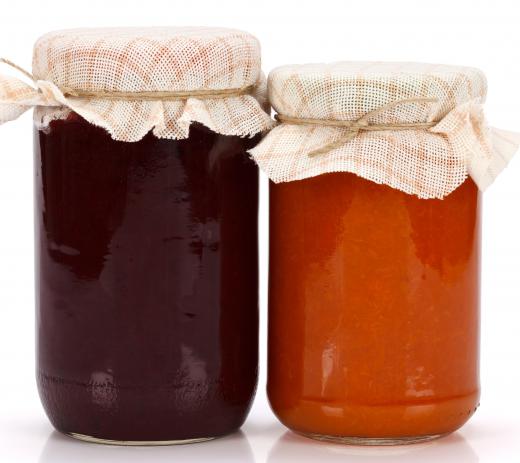 A boiling water canner may be used to sterilize jars of jam.