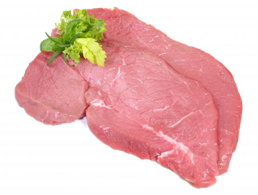 Raw veal chops.