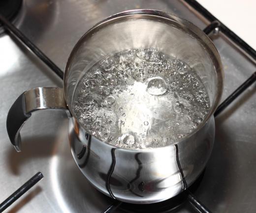 Large, continuous bubbles covering the surface of the water signal a rolling boil.