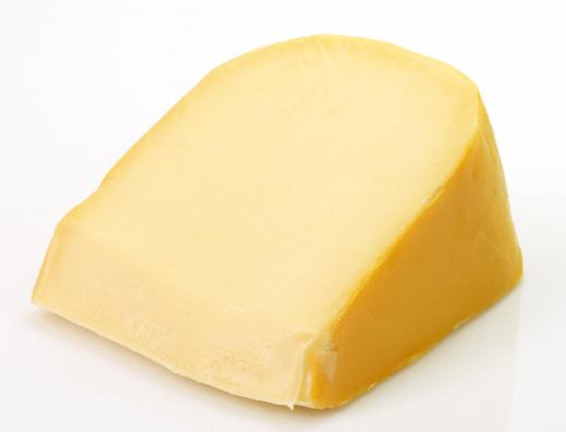 Wedge of gouda cheese.