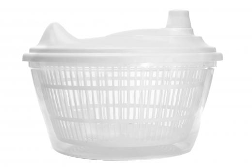 A salad spinner is a bowl (usually plastic) that has a removable strainer and special top that, when closed and activated, spins the salad inside the bowl in order to remove excess water.