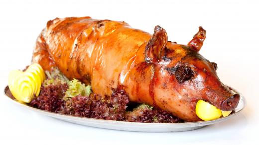 A roasting spit is used to roast large pieces of meat, like whole pigs at a Hawaiian luau.