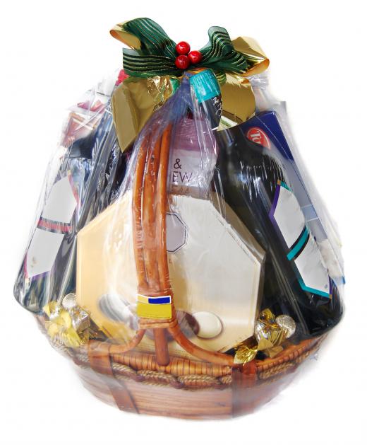 A gift basket wrapped in a cellophane bag.